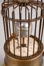 Wecker als Vogelkäfig