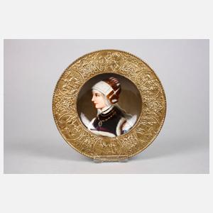 Paar Porzellanteller mit Messingmontierung