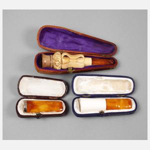 Drei Zigarettenspitzen