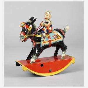 Gama Clown auf Schaukelesel