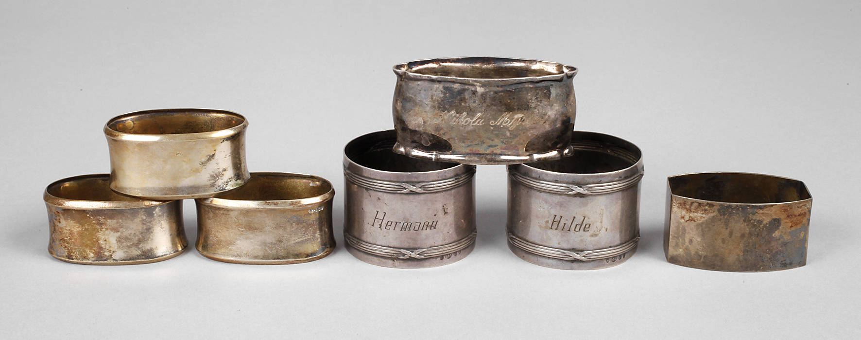 Sieben Serviettenringe Silber