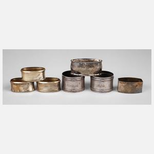 Sieben Serviettenringe Silber