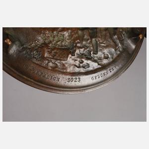 Bronzeteller mit Putten