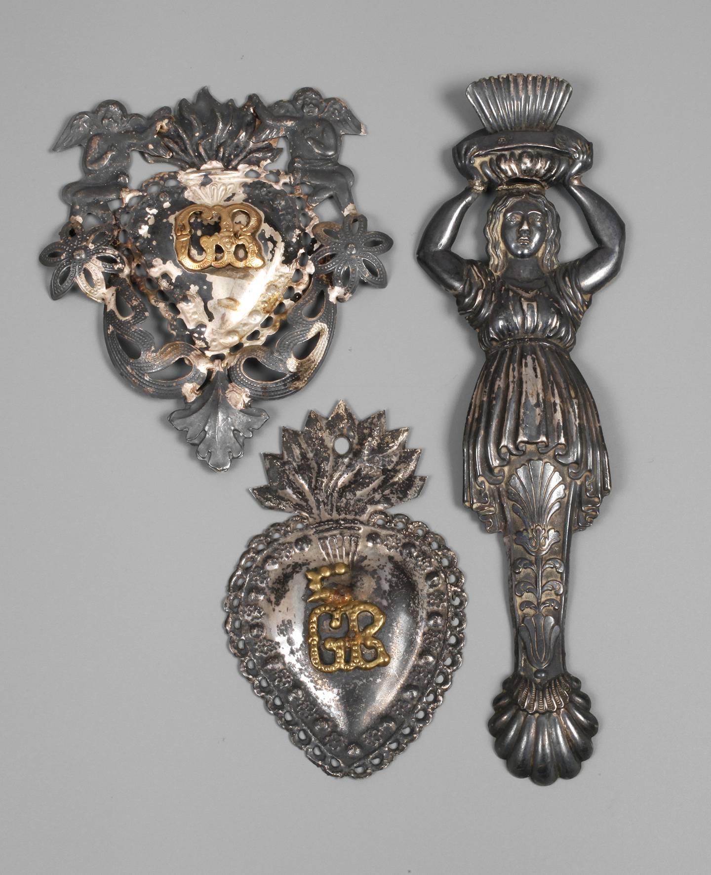 Drei Silberbeschläge