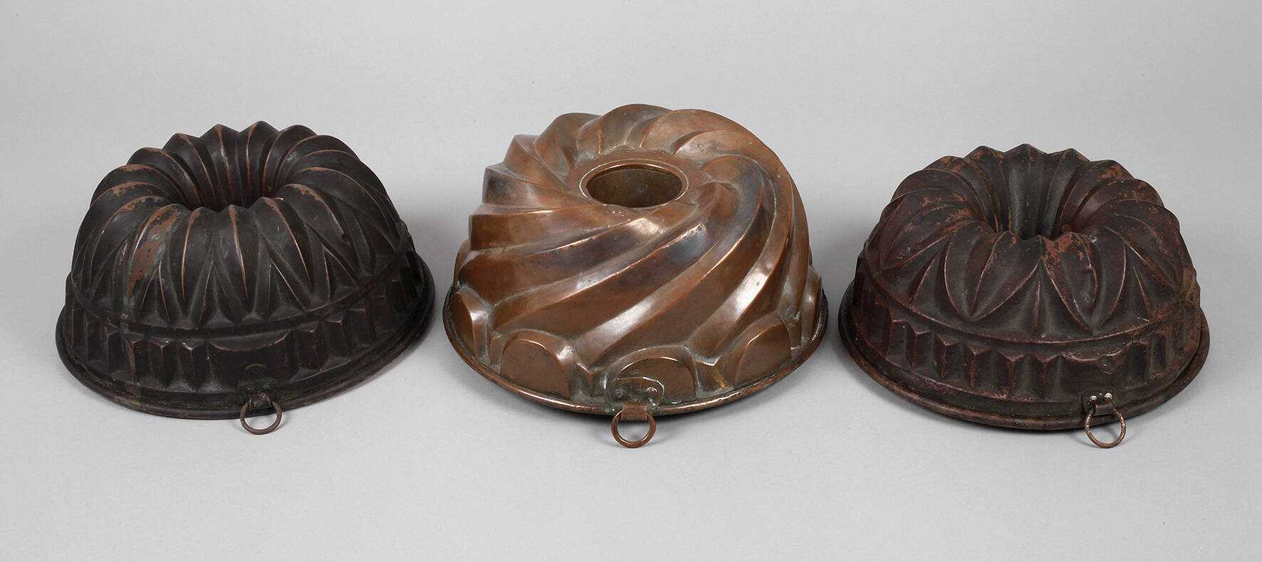 Drei Kupferbackformen