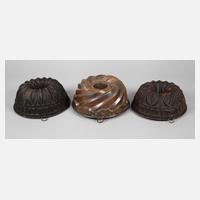 Drei Kupferbackformen111