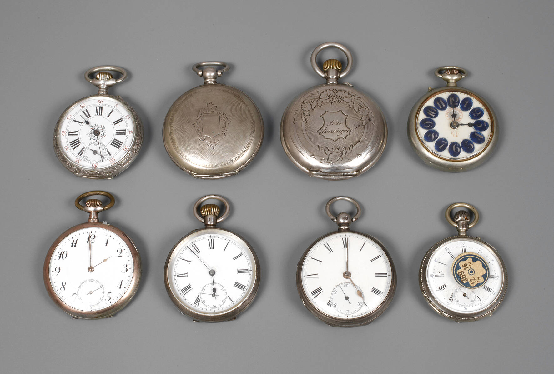 Acht Taschenuhren