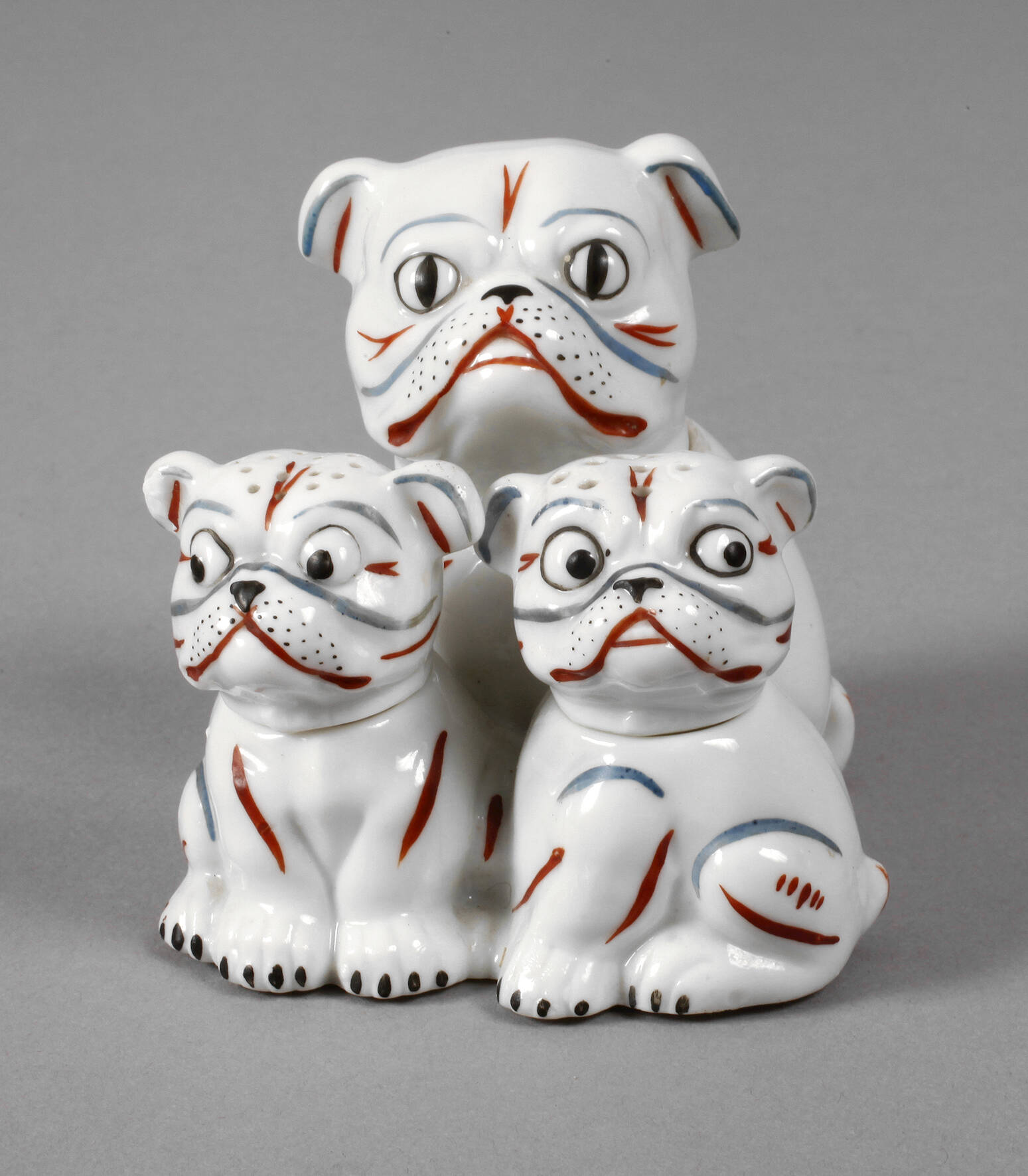 Groteske Hundegruppe als Menage