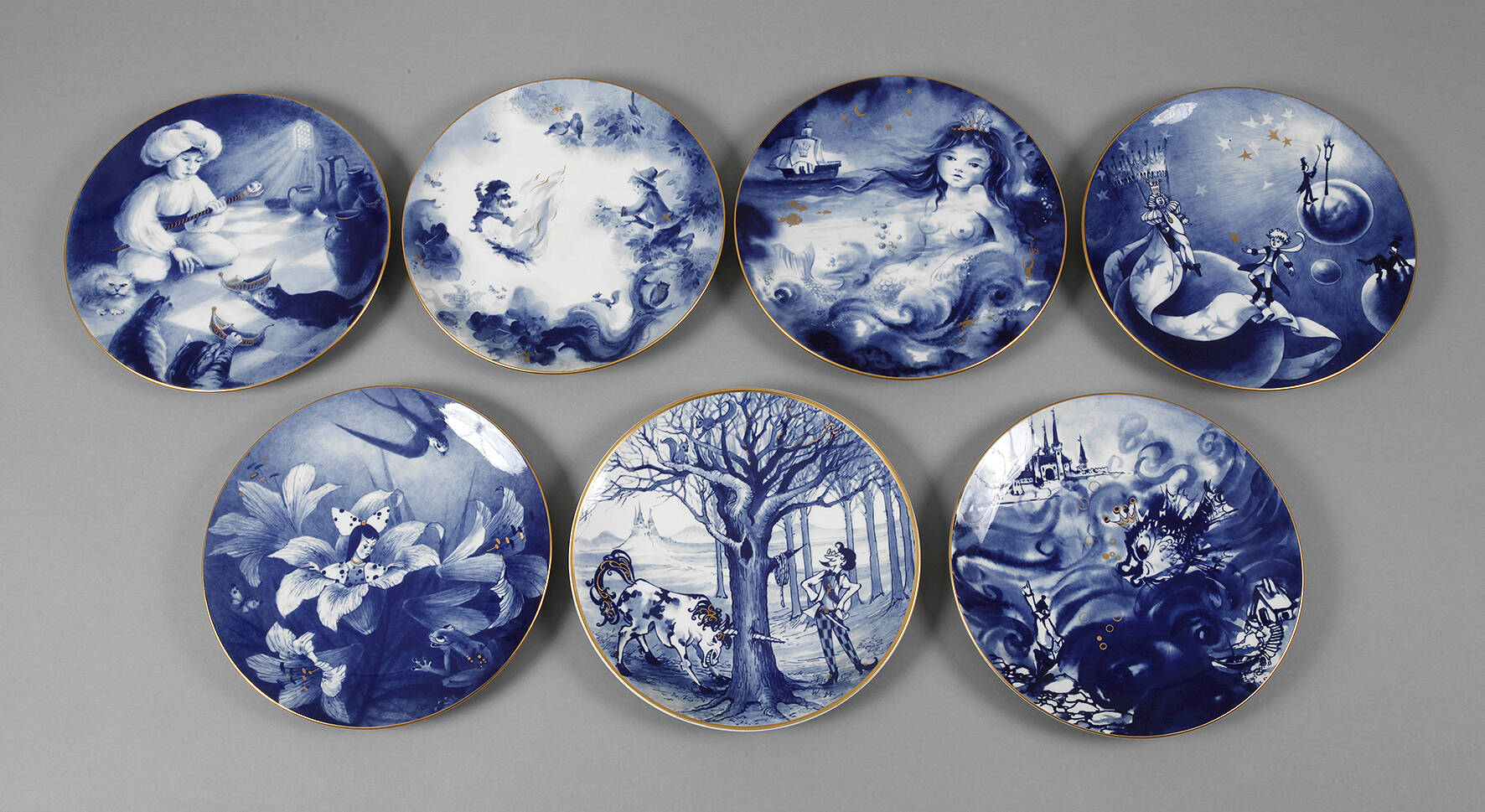 Meissen sieben Märchenteller mit Goldrand