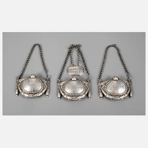 Vier Flaschenplaketten Silber