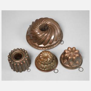 Vier Kupferbackformen