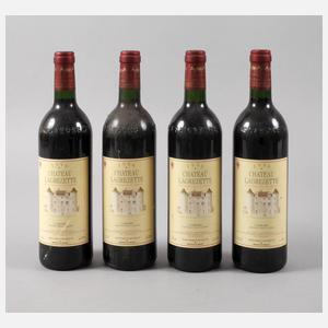 Vier Flaschen Rotwein
