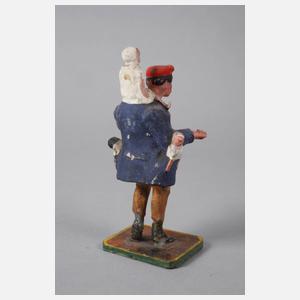 Wackelkopffigur als Puppenverkäufer