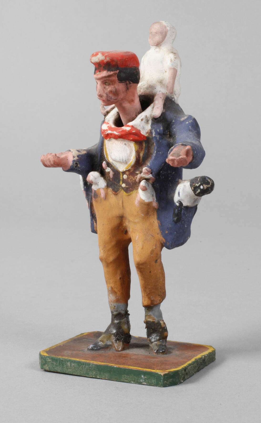 Wackelkopffigur als Puppenverkäufer