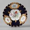 Meissen kleiner Prunkteller mit Blumenmalerei und Kobaltfond