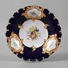 Meissen Prunkteller mit Blumenmalerei und Kobaltfond