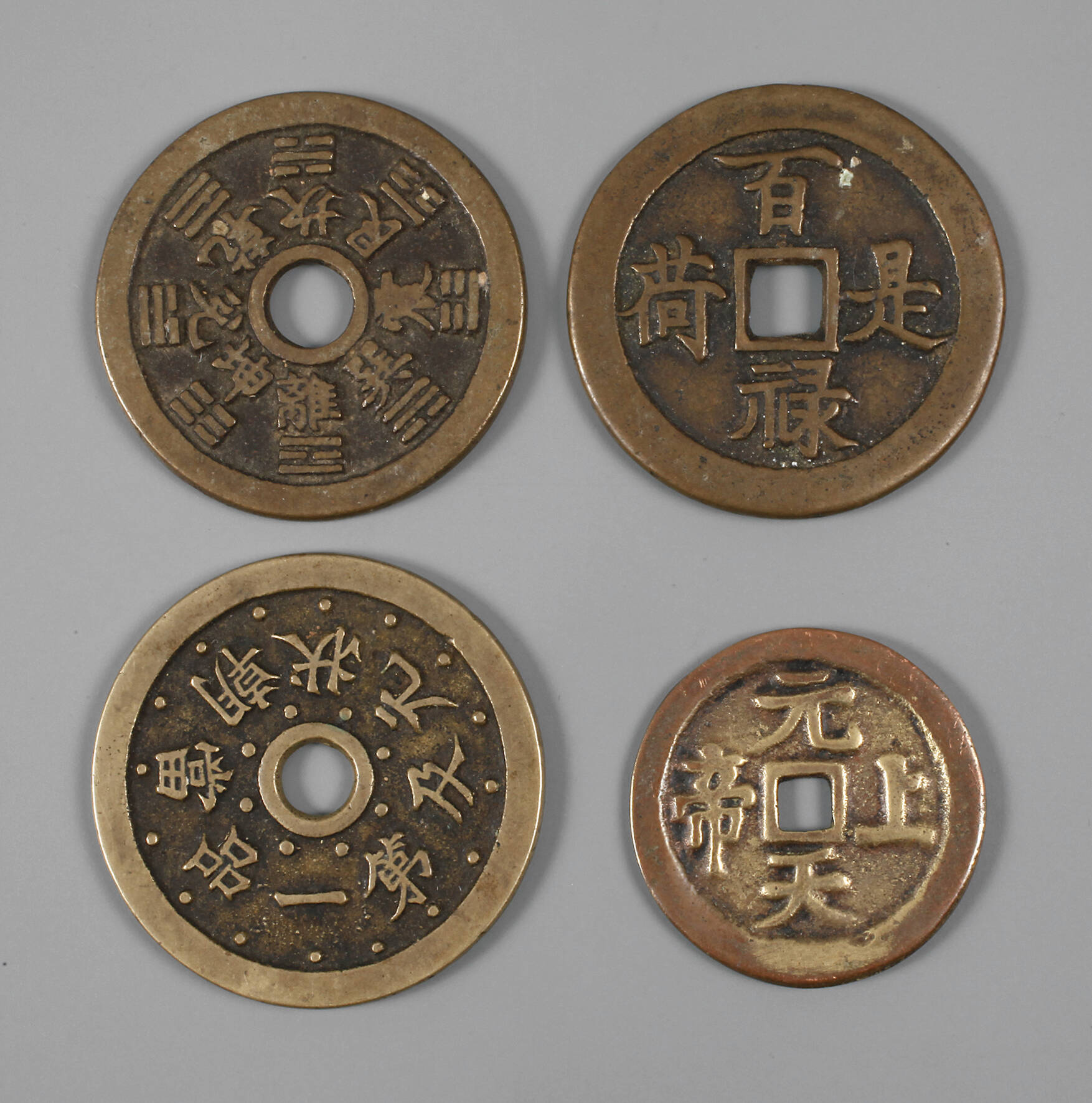 Vier Käschmünzen
