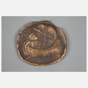 Drei Bronzeplaketten